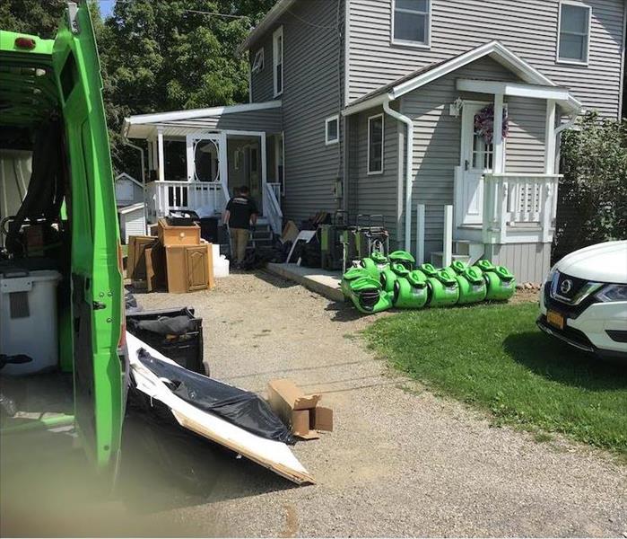 SERVPRO techs on job site, with equipment ready to go.