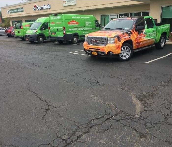 SERVPRO vehicles parked in plaza