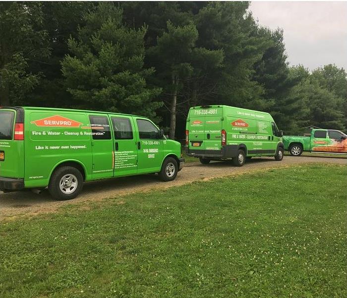 SERVPRO vehicles in driveway