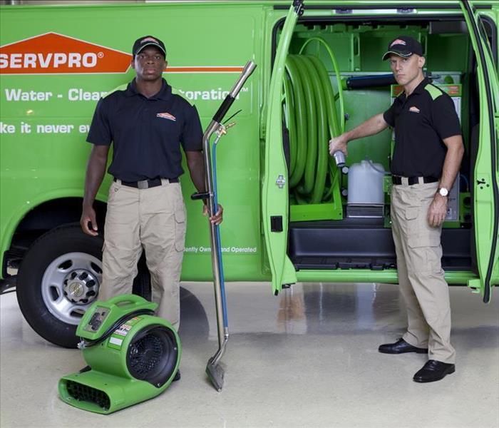 SERVPRO technicians with drying equipment